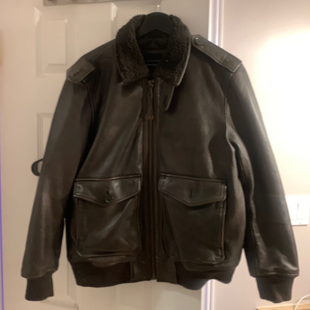An aviator inspired leather jacket with faux sherpa collar.